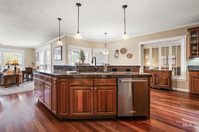 kitchen with dark wood-style floors, pendant lighting, glass insert cabinets, a sink, and dishwasher