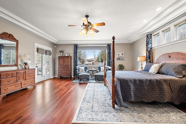 bedroom with wood finished floors, a ceiling fan, baseboards, access to exterior, and crown molding