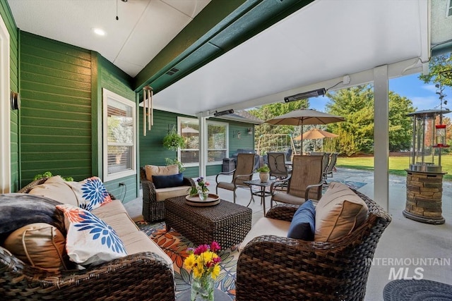 view of patio with an outdoor hangout area and outdoor dining space