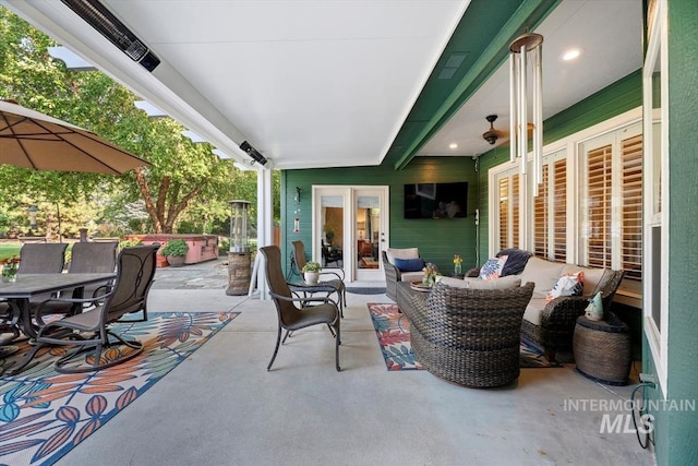 view of patio / terrace featuring outdoor dining space, french doors, and outdoor lounge area