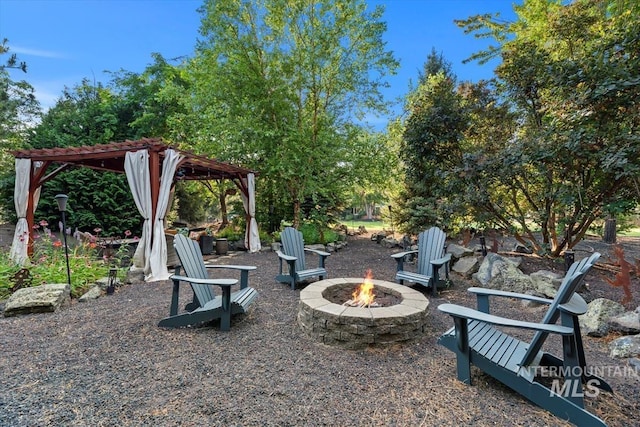 view of patio / terrace featuring an outdoor fire pit