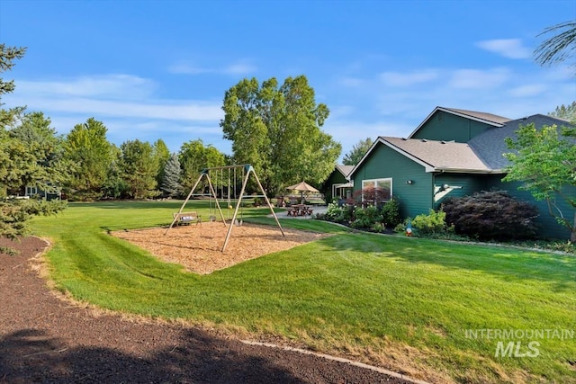 community playground featuring a lawn