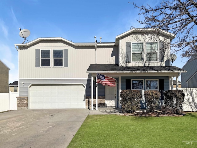 view of front of home with an attached garage, driveway, fence, and a front yard