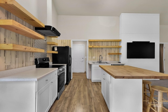 321 S Powerline Rd, Nampa, ID 83686 - kitchen with open shelves, electric range, wood counters, and a breakfast bar area