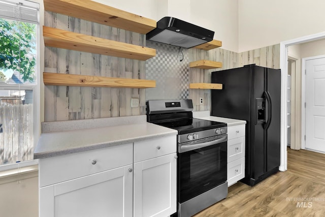 321 S Powerline Rd, Nampa, ID 83686 - kitchen featuring open shelves, electric stove, wall chimney range hood, black refrigerator with ice dispenser, and white cabinetry