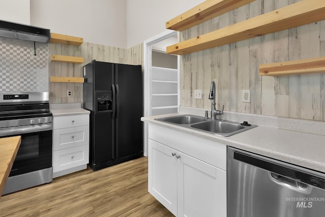 321 S Powerline Rd, Nampa, ID 83686 - kitchen featuring open shelves, stainless steel appliances, exhaust hood, white cabinetry, and light countertops