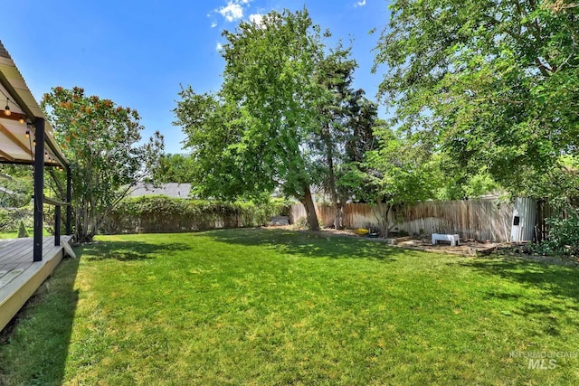 321 S Powerline Rd, Nampa, ID 83686 - fenced backyard with a deck