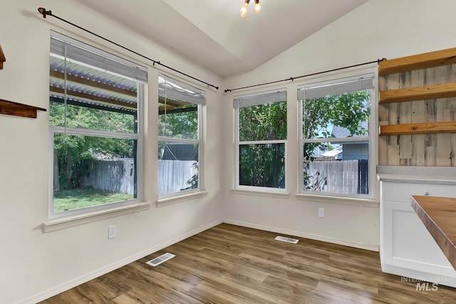 321 S Powerline Rd, Nampa, ID 83686 - unfurnished dining area featuring vaulted ceiling and wood finished floors