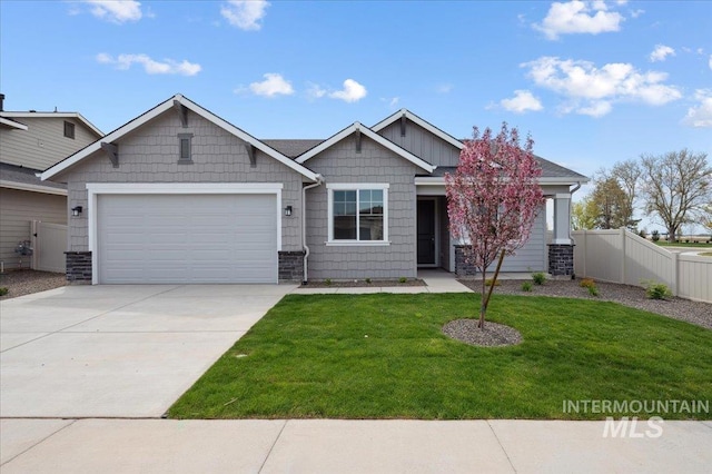 6303 W Pewter Point St, Meridian, ID 83646 - craftsman house featuring a garage and driveway