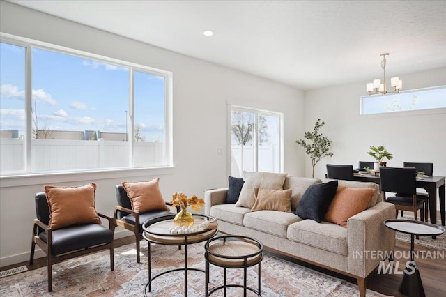6303 W Pewter Point St, Meridian, ID 83646 - living area with a chandelier, wood finished floors, and recessed lighting