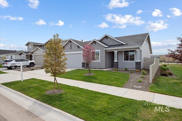6303 W Pewter Point St, Meridian, ID 83646 - craftsman house featuring concrete driveway, a garage, and board and batten siding