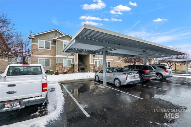 view of vehicle parking featuring a carport