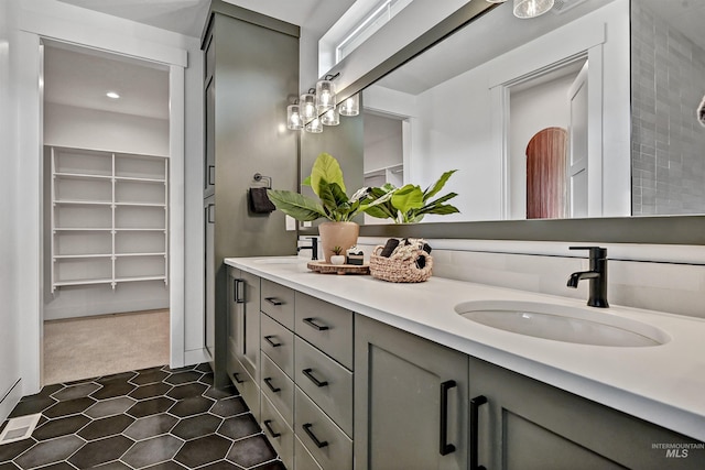 11844 N 21st Ave, Boise, ID 83714 - bathroom with double vanity, a spacious closet, and recessed lighting