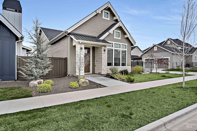11844 N 21st Ave, Boise, ID 83714 - view of front of home featuring a standing seam roof, stone siding, and metal roof