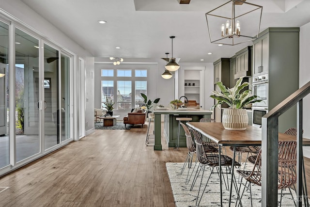 11844 N 21st Ave, Boise, ID 83714 - dining area with recessed lighting, light wood-style floors, a chandelier, and baseboards