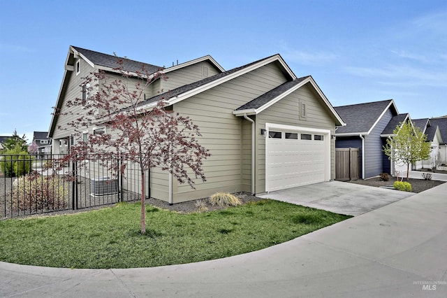 11844 N 21st Ave, Boise, ID 83714 - view of front of house with a garage, driveway, and a shingled roof