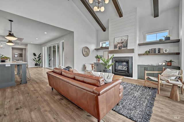 11844 N 21st Ave, Boise, ID 83714 - living area featuring light wood-style floors, a large fireplace, and recessed lighting