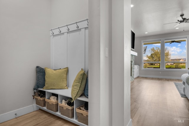 mudroom with wood-type flooring