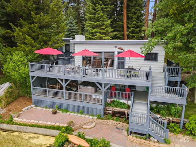 rear view of house with a patio and a deck