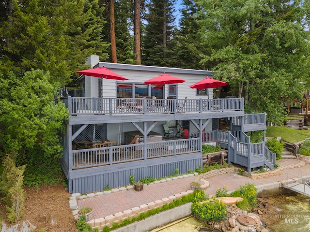 back of house featuring a wooden deck