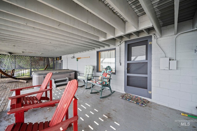 view of patio with a hot tub