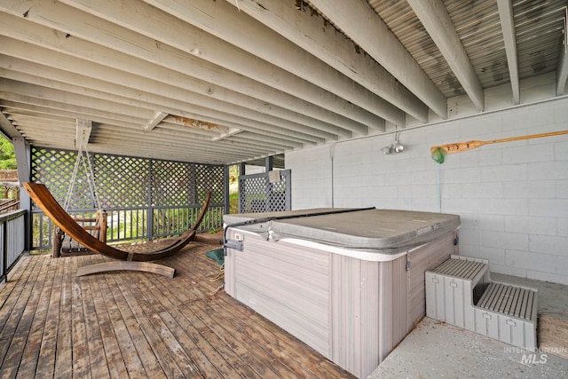 wooden terrace with a hot tub