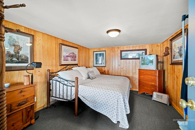 bedroom with dark colored carpet