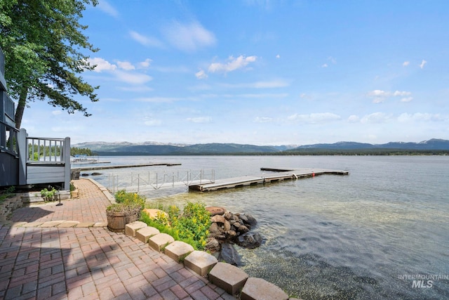 dock area featuring a water and mountain view