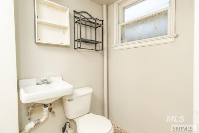 bathroom with toilet and sink