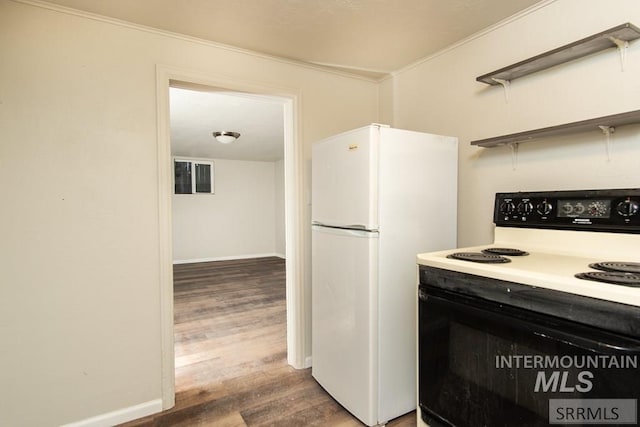 kitchen with wood-type flooring, white appliances, and ornamental molding