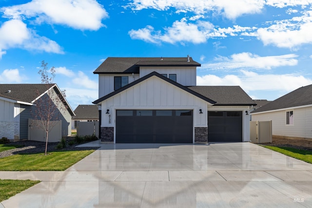 view of front of house with a garage and a front yard