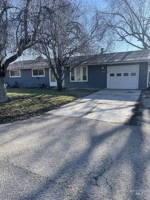 single story home with a garage