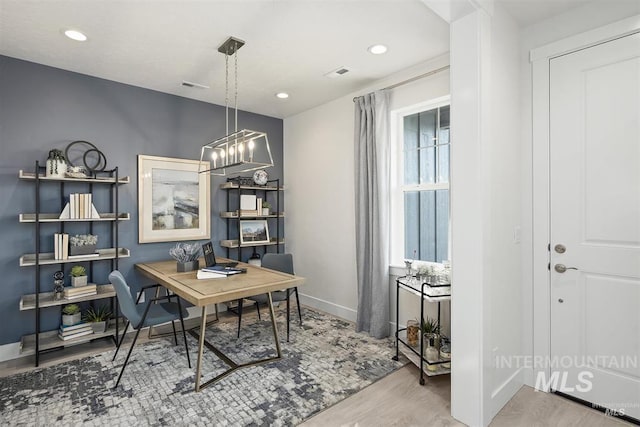home office with visible vents, wood finished floors, baseboards, a notable chandelier, and recessed lighting