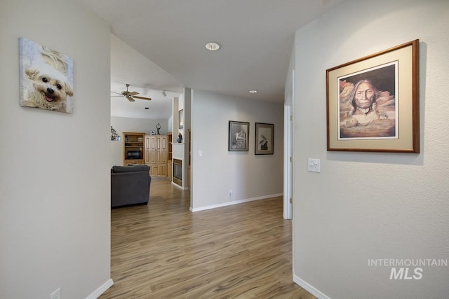 3411 Wilson Ln, Nampa, ID 83686 - corridor featuring baseboards, wood finished floors, and recessed lighting