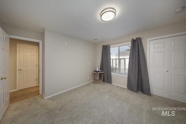 3411 Wilson Ln, Nampa, ID 83686 - unfurnished bedroom featuring light carpet and baseboards