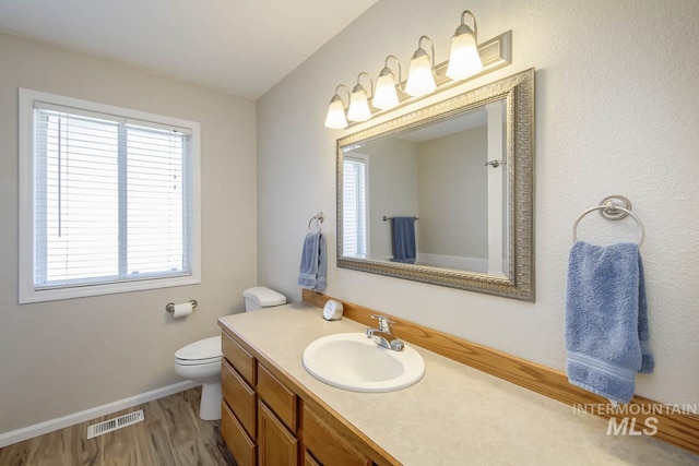 3411 Wilson Ln, Nampa, ID 83686 - bathroom featuring vanity, toilet, and baseboards