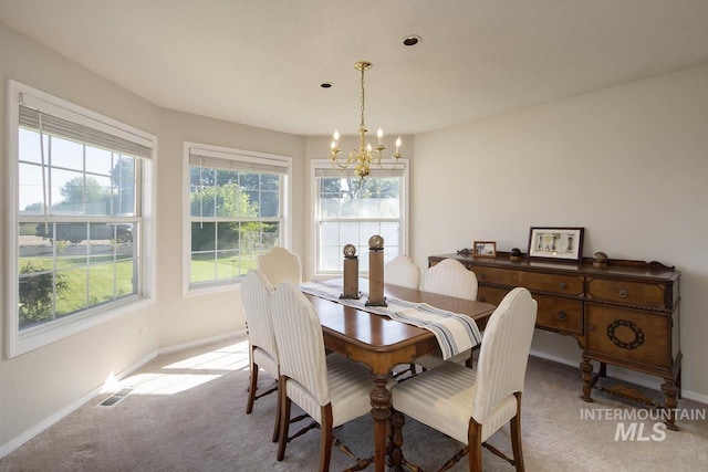3411 Wilson Ln, Nampa, ID 83686 - dining room with a chandelier, carpet, and baseboards