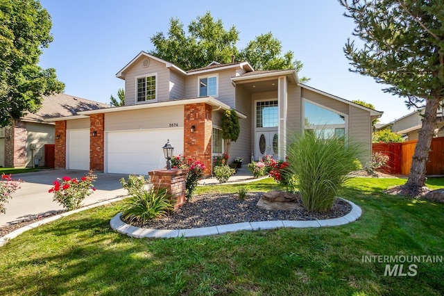 view of front of property with fence, a front lawn, concrete driveway, and brick siding