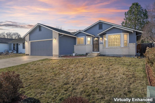 3105 E Eastgate Dr, Boise, ID 83716 - single story home featuring a front lawn, fence, concrete driveway, a garage, and brick siding