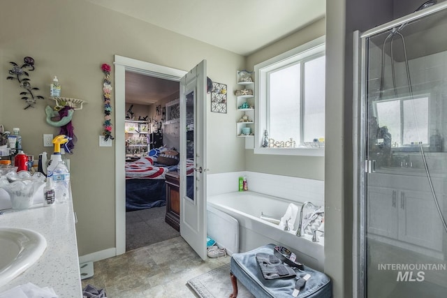 3744 S Antler Rdg, Boise, ID 83709 - bathroom with a stall shower, a garden tub, and a sink