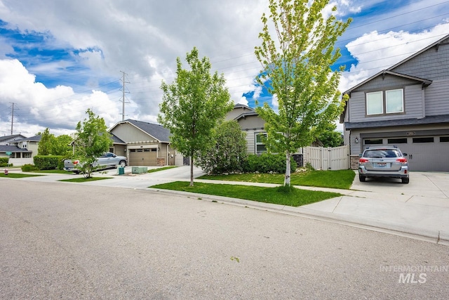 3744 S Antler Rdg, Boise, ID 83709 - obstructed view of property with driveway, a residential view, a garage, and fence