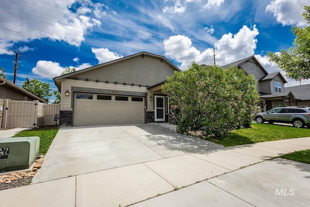 3744 S Antler Rdg, Boise, ID 83709 - view of front facade featuring a gate, an attached garage, concrete driveway, and stone siding