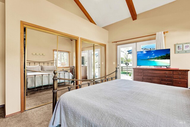 carpeted bedroom featuring beam ceiling, high vaulted ceiling, access to outside, and two closets