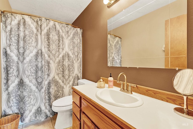 bathroom featuring tile patterned floors, toilet, vanity, a textured ceiling, and a shower with shower curtain