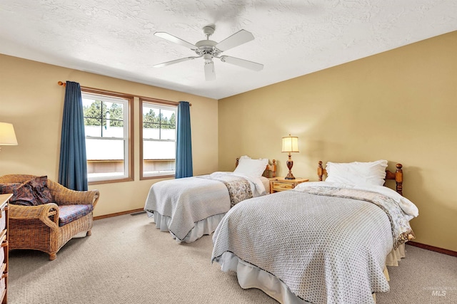 bedroom with light carpet, baseboards, and a ceiling fan