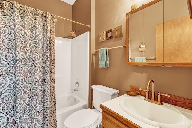 bathroom with shower / bath combo with shower curtain, toilet, a textured wall, and vanity