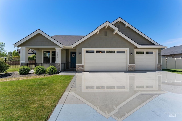 1031 E Reflect Ridge Dr, Meridian, ID 83642 - craftsman house with stone siding, a garage, covered porch, and concrete driveway
