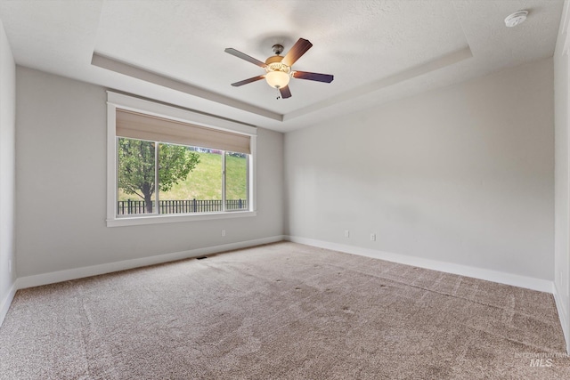 1031 E Reflect Ridge Dr, Meridian, ID 83642 - carpeted spare room with a raised ceiling, baseboards, a smoke detector, and a ceiling fan