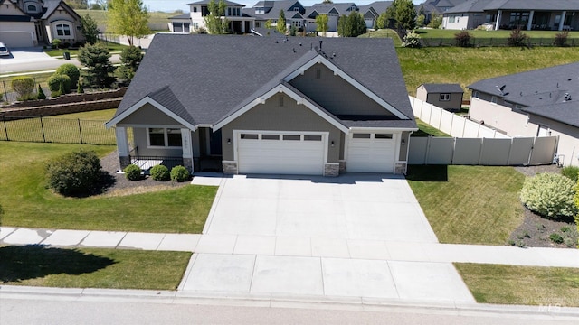 1031 E Reflect Ridge Dr, Meridian, ID 83642 - view of front of property featuring stone siding, a residential view, a garage, and concrete driveway