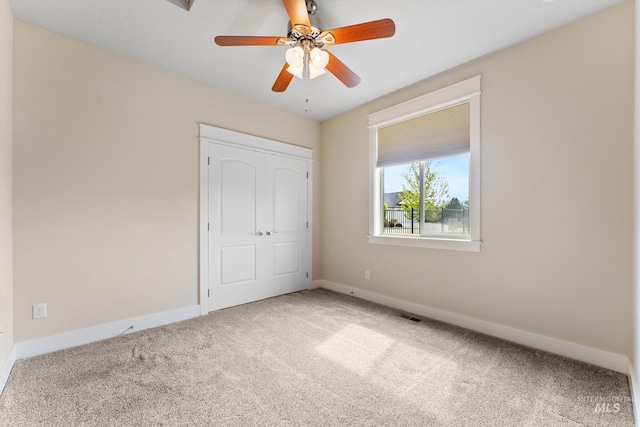 1031 E Reflect Ridge Dr, Meridian, ID 83642 - unfurnished bedroom featuring carpet flooring, baseboards, and a ceiling fan